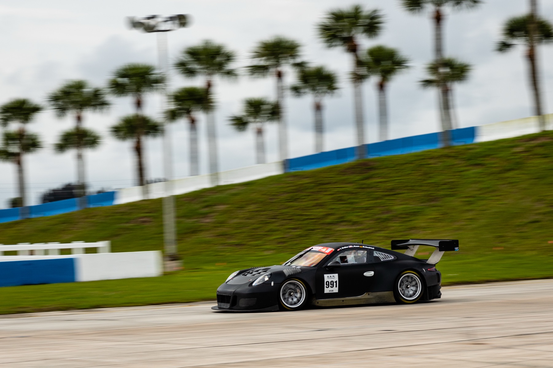 Speed Syndicate Porsche Cup car on track at Sebring, with trackside support hours from Sebring, Daytona, and Homestead
